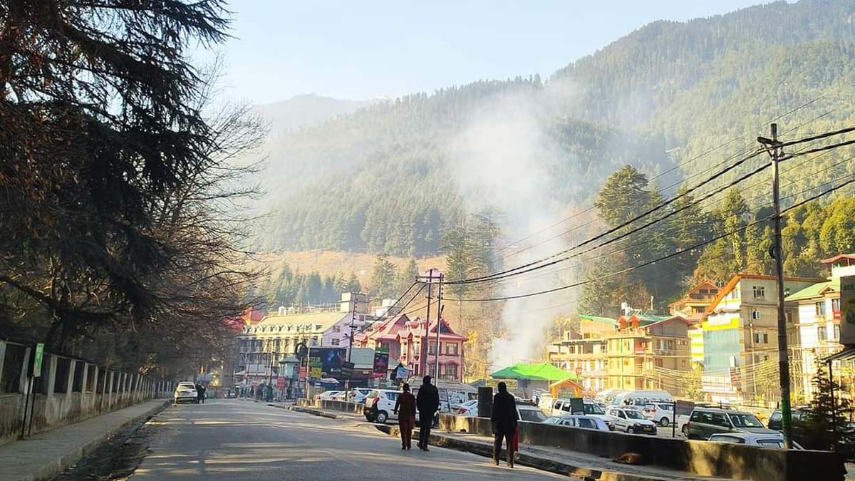 a group of people walking on a street of Old Manali