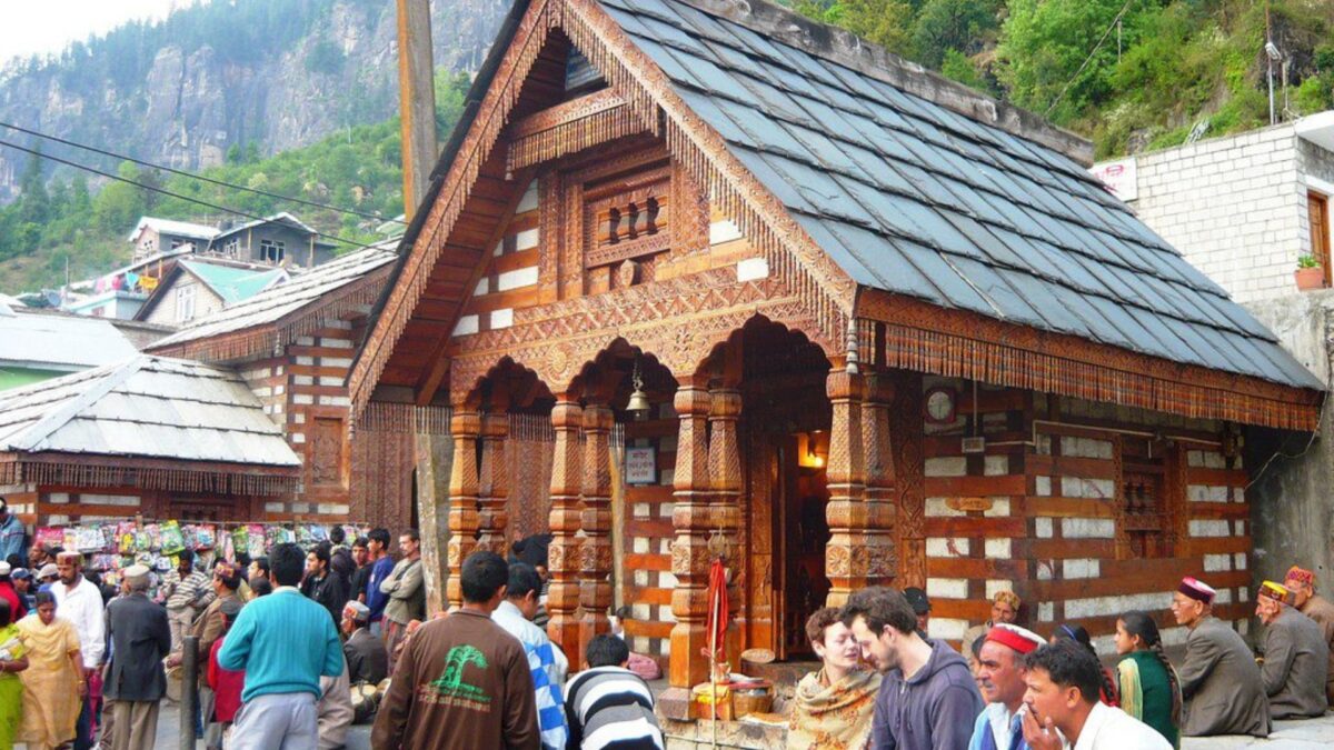 a group of people outside of Vashisht Temple in Manali