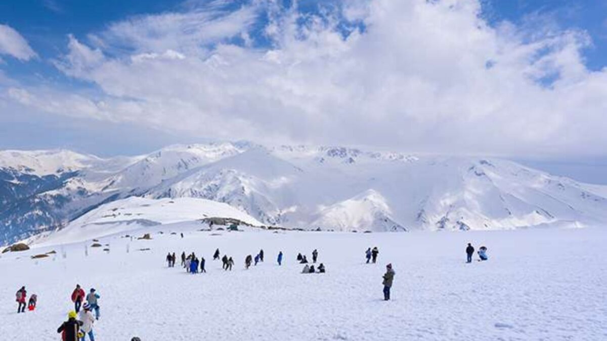 group of people playing with snow in Gulmarg