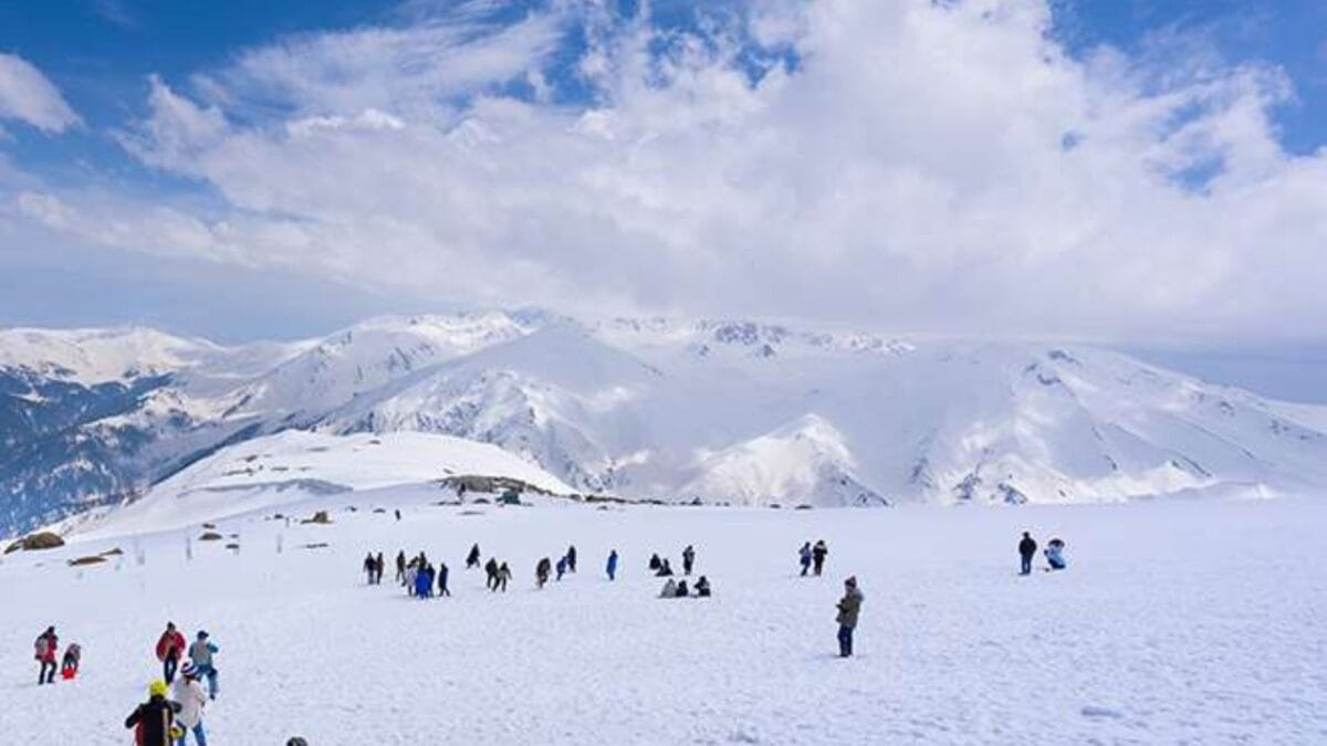 group of people playing with snow in Gulmarg